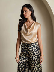 Gold 19Momme mulberry silk cap sleeve cowl neck women's top with leopard print pants.