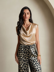 Women's gold 19Momme silk cap sleeve cowl neck top with leopard print pants.