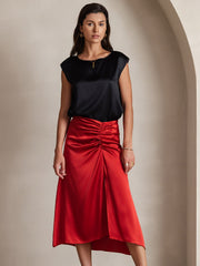 Women's black 19 Momme mulberry silk cap sleeve round neck top with a red ruched silk skirt.