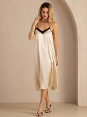 Women's 19Momme mulberry silk contrast V-neck midi dress in champagne with black trim and spaghetti straps.