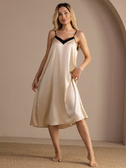 Women's champagne mulberry silk midi nightgown with black contrast V-neck and spaghetti straps.