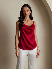 Red 19 Momme mulberry silk cowl neck camisole top on a woman, paired with white pants.