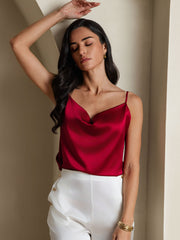 Red 19Momme mulberry silk cowl neck camisole top on a woman, paired with white pants.