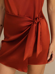 Rust 19Momme mulberry silk cowl neck sleeveless short dress with waist tie.