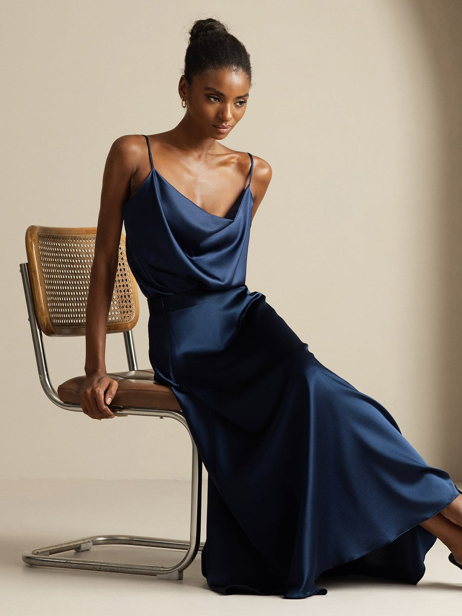 Dark blue 19Momme mulberry silk cowl neck camisole top and A-line maxi skirt set on a woman.