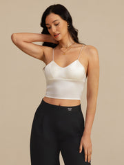 White 19Momme mulberry silk crop top with spaghetti straps and V-neck, worn by a woman.