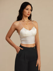White 19Momme silk crop top camisole with spaghetti straps and V-neck, worn by a woman.