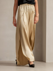 Gold 19Momme mulberry silk fashionable flowy high-slit palazzo pants with elastic waist.
