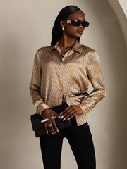 Women's 19Momme silk geometric print long sleeve lapel collar shirt in brown and blue, paired with black pants.