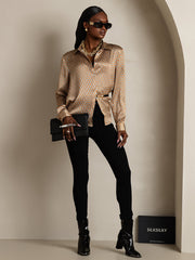 Women's 19Momme mulberry silk geometric print long sleeve lapel collar shirt with black pants.
