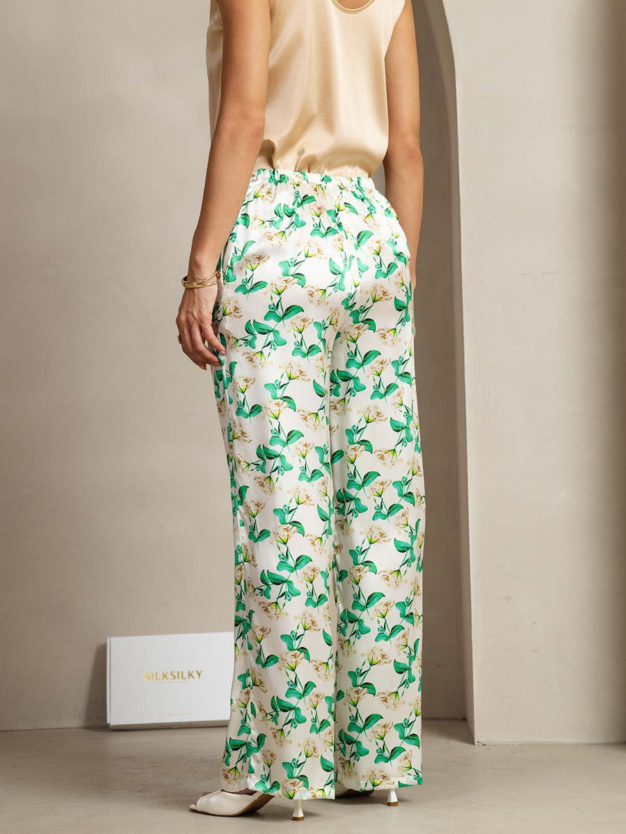Women's 19Momme mulberry silk green floral print wide leg pants with side pockets.