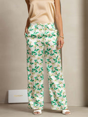 Women's 19 Momme mulberry silk green floral print wide-leg pants with side pockets.
