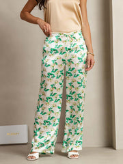 Women's 19Momme silk green floral print wide-leg pants with side pockets.
