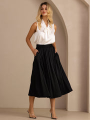 Woman in a black 19Momme mulberry silk high-waist A-line pleated long skirt with side pockets.