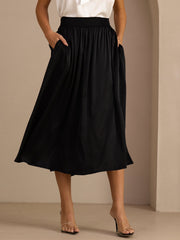 Black 19Momme mulberry silk high-waist A-line pleated long skirt with side pockets.