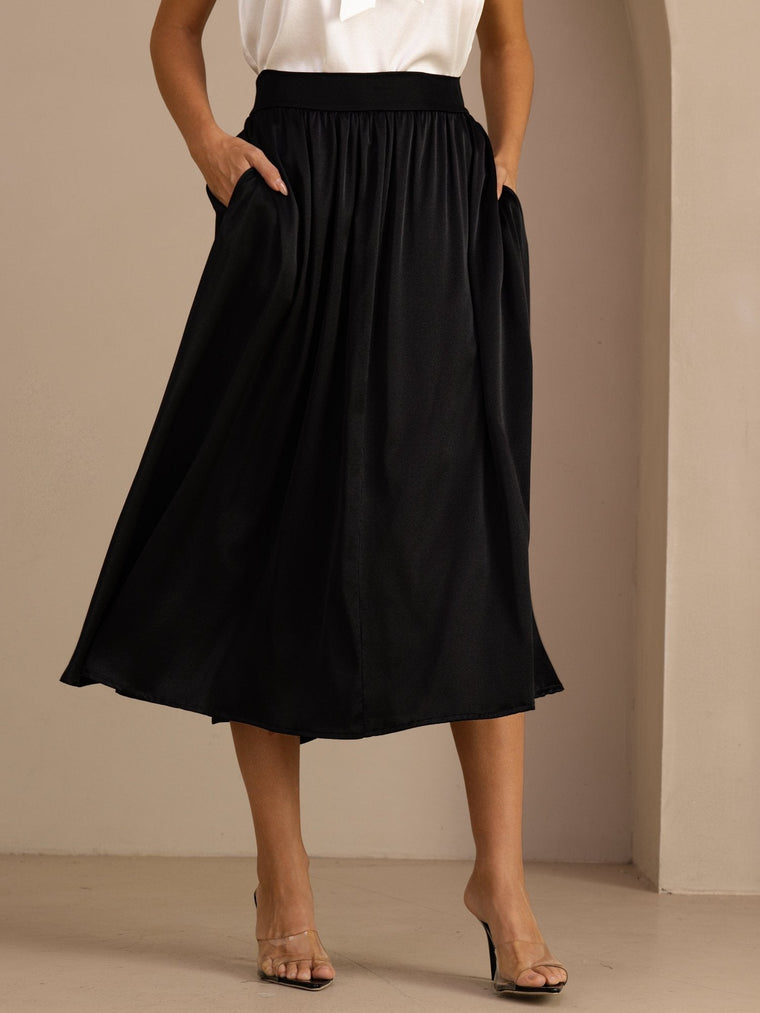 Black 19Momme mulberry silk high-waist A-line pleated long skirt with side pockets.