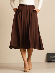 Bitter Chocolate mulberry silk A-line pleated midi skirt with pockets, worn with a white top and nude heels.