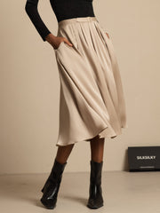 19Momme mulberry silk high waist A-line pleated midi skirt with pockets in champagne.