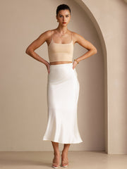 Elegant white 19Momme mulberry silk high waist maxi skirt paired with a beige crop top.