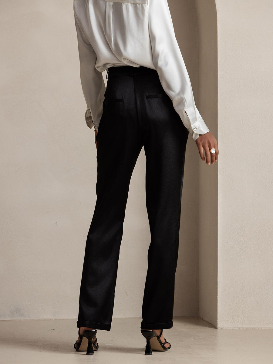 Women's black 19 Momme mulberry silk high waist straight fit pants with zipper side pockets.