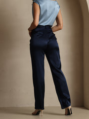 Women's navy 19Momme mulberry silk high-waist straight-fit pants with zipper side pockets, paired with a light blue silk top.