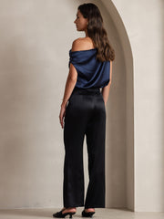 Women's black 19Momme mulberry silk high-waist wide-leg pleated pants with a navy off-shoulder silk top.
