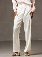 White 19Momme mulberry silk high waist wide leg pleated women's pants with a light pink silk top.