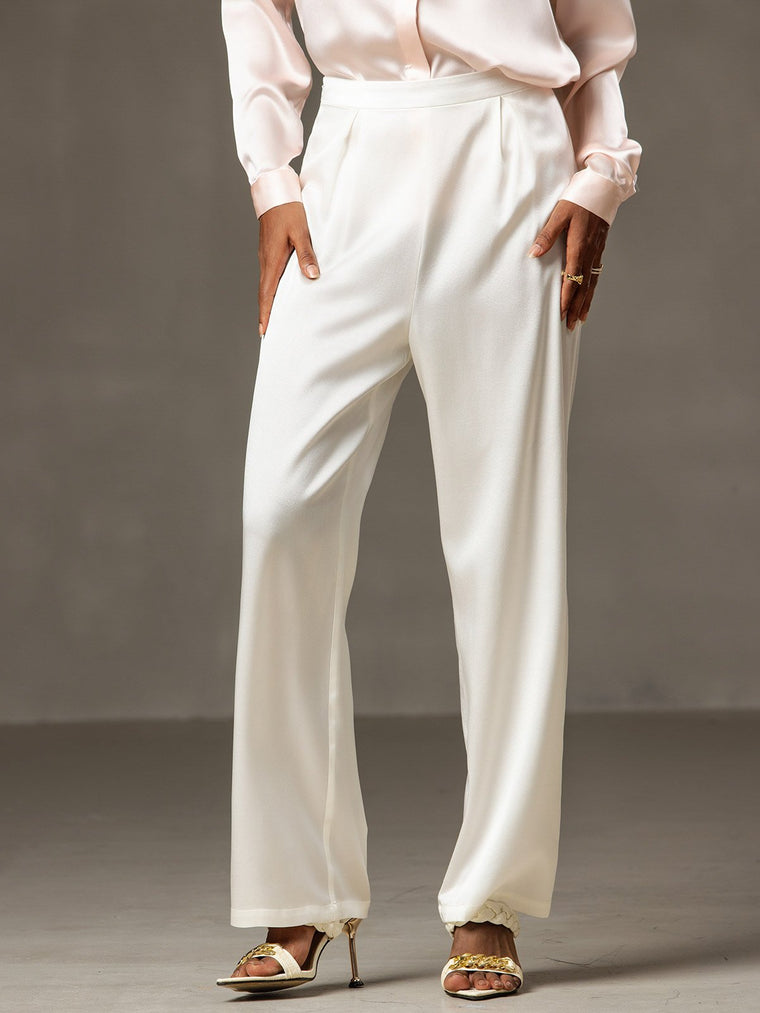 White 19Momme mulberry silk high waist wide leg pleated women's pants with a light pink silk top.