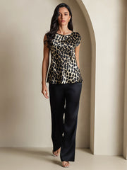 Women's 19Momme mulberry silk leopard print cap sleeve round neck top with black pants.