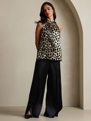 Women's 19Momme silk leopard print sleeveless halter neck top with black wide-leg pants.