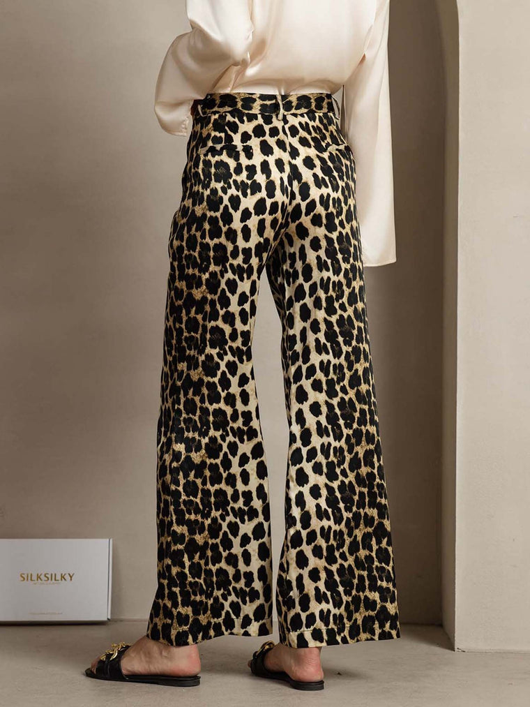 Women's 19 Momme mulberry silk leopard print straight leg pants with side pockets.