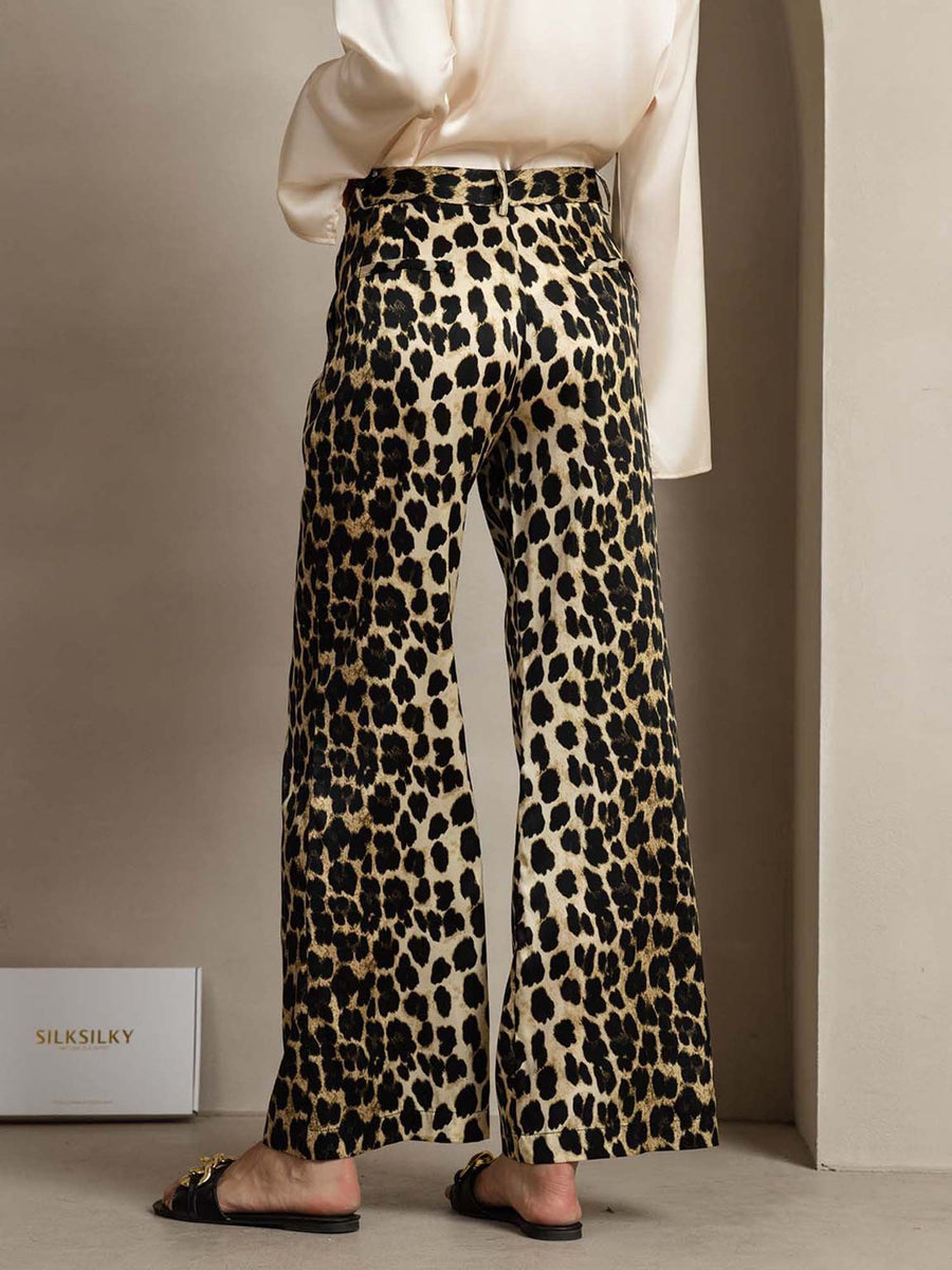 Women's 19 Momme mulberry silk leopard print straight leg pants with side pockets.