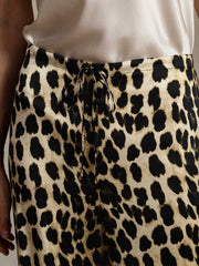 Women's 19 Momme mulberry silk leopard print wide leg pants with drawstring waist and side pockets.