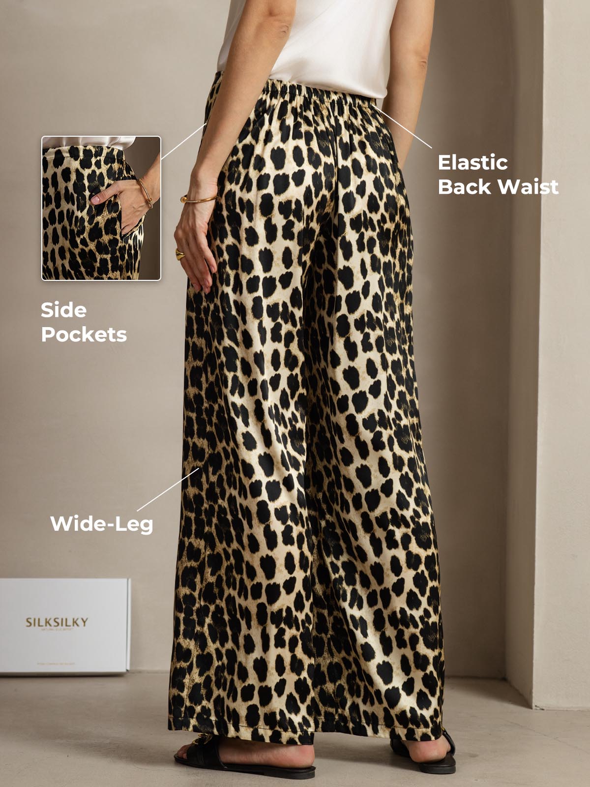 Women's 19Momme silk leopard print wide-leg pants with elastic back waist and side pockets.