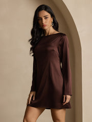 Woman in a brown 19Momme mulberry silk long sleeve boat neck short dress.