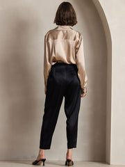Women's champagne 19Momme mulberry silk long sleeve lapel collar shirt with black trousers.