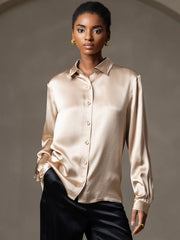 Women's champagne 19Momme mulberry silk long sleeve lapel collar shirt with black pants.