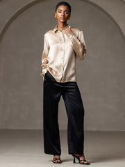 Women's champagne 19 Momme mulberry silk long sleeve lapel collar shirt with black silk pants.