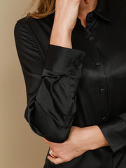Black 19Momme mulberry silk long sleeve lapel collar women's shirt, showcasing buttoned cuffs and a smooth texture.