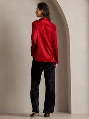 Women's red mulberry silk long sleeve lapel collar shirt with black silk pants.