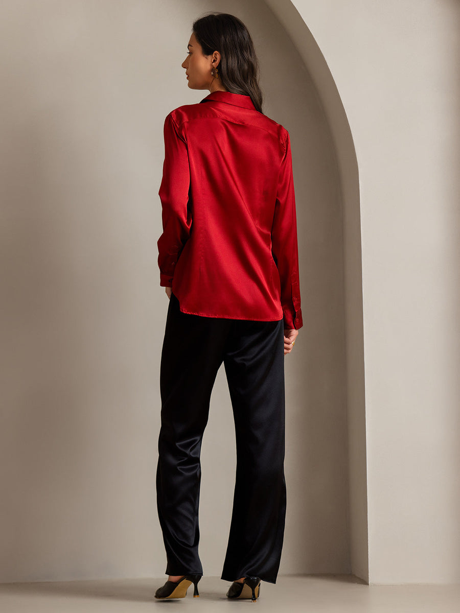 Women's red mulberry silk long sleeve lapel collar shirt with black silk pants.