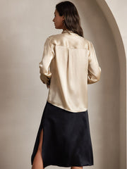 Women's champagne mulberry silk long sleeve tie neck blouse with gathered shoulders.