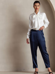 Women's white mulberry silk long sleeve tie neck blouse and navy silk pants.