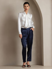 White 19Momme mulberry silk long sleeve tie neck blouse with navy silk pants.