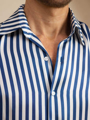 Men's 19Momme mulberry silk long sleeve shirt with blue and white stripe print, lapel collar, and white buttons.
