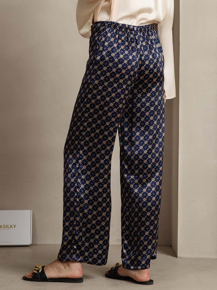 Navy 19Momme mulberry silk wide-leg women's pants with chain print and side pockets.