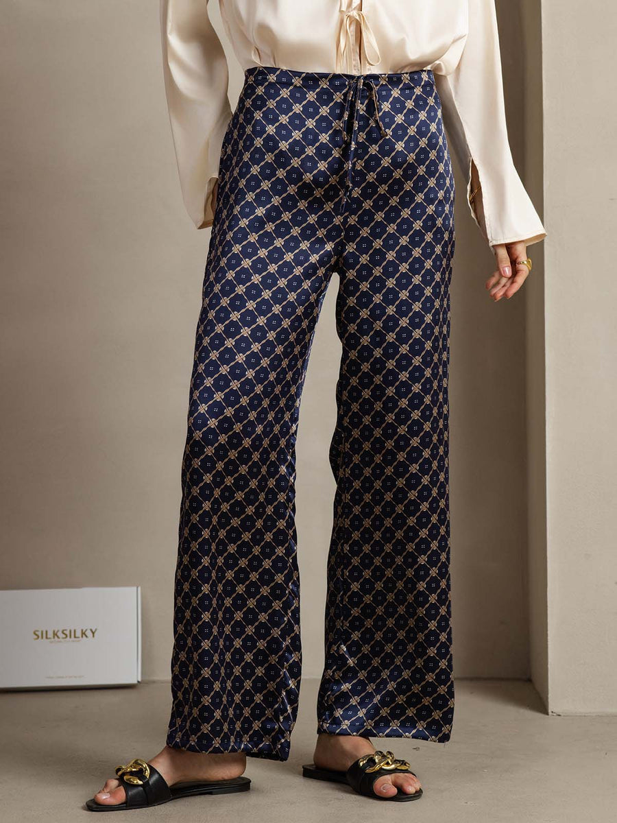 Women's 19Momme mulberry silk navy chain print wide-leg pants with side pockets.