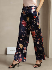 Women's navy 19 Momme silk wide-leg pants with floral print and side pockets.