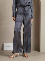 Navy ginkgo print 19Momme mulberry silk wide-leg women's pants with side pockets.