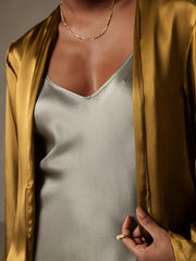 Women's 19Momme mulberry silk relaxed long sleeve tie-front cardigan in golden yellow over a sage silk top.